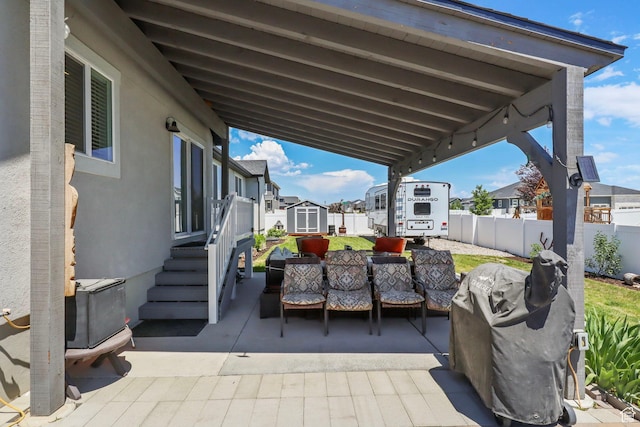 4764 N Gunsight Peak Dr, Eagle Mountain, UT 84005 - view of patio with an outdoor hangout area, a shed, and a residential view