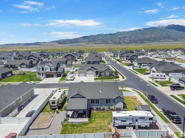 4764 N Gunsight Peak Dr, Eagle Mountain, UT 84005 - aerial perspective of suburban area with a mountain backdrop