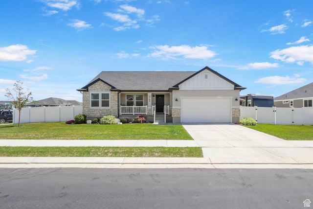 4764 N Gunsight Peak Dr, Eagle Mountain, UT 84005 - ranch-style home featuring a porch, stone siding, an attached garage, and concrete driveway