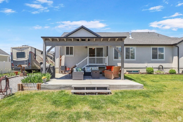 4764 N Gunsight Peak Dr, Eagle Mountain, UT 84005 - back of house with an outdoor hangout area, a patio area, stucco siding, and a lawn