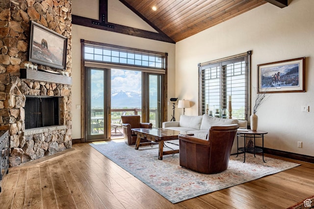 285 N Kings Peak Ct, Heber City, UT 84032 - living area with hardwood / wood-style floors, wood ceiling, high vaulted ceiling, and a stone fireplace
