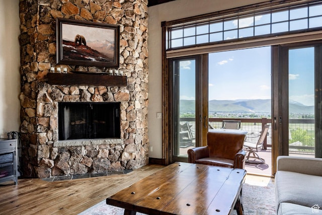 285 N Kings Peak Ct, Heber City, UT 84032 - living room with a mountain view, wood finished floors, healthy amount of natural light, and a fireplace