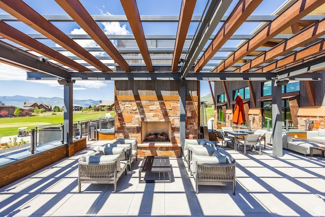 285 N Kings Peak Ct, Heber City, UT 84032 - view of patio / terrace with a mountain view, an outdoor living space with a fireplace, and a pergola