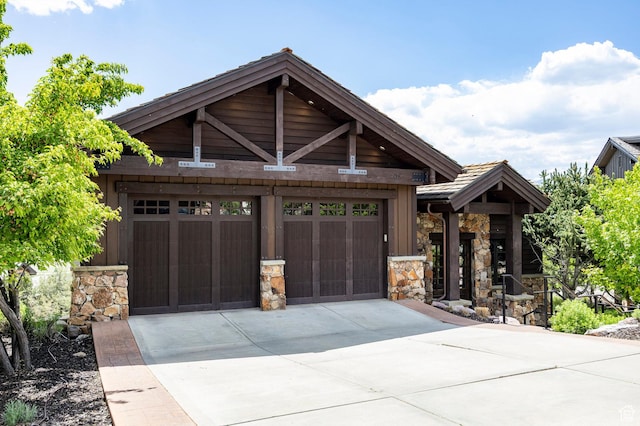 285 N Kings Peak Ct, Heber City, UT 84032 - craftsman-style house featuring stone siding and driveway