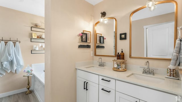 748 S Crooked Post Way, Saratoga Springs, UT 84045 - bathroom with double vanity, a bath, and wood finished floors