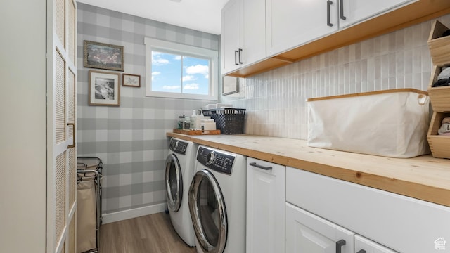 748 S Crooked Post Way, Saratoga Springs, UT 84045 - laundry area featuring cabinet space, washer and clothes dryer, wood finished floors, and wallpapered walls