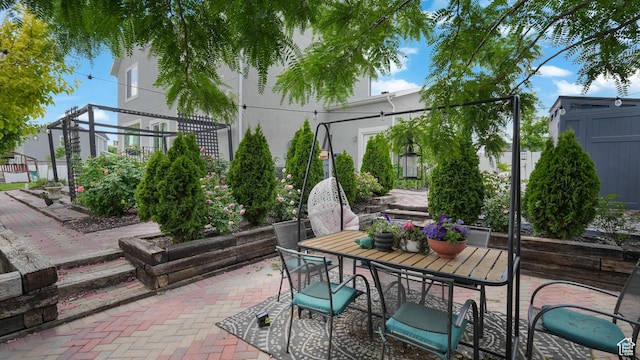 748 S Crooked Post Way, Saratoga Springs, UT 84045 - view of patio / terrace featuring outdoor dining area and a shed