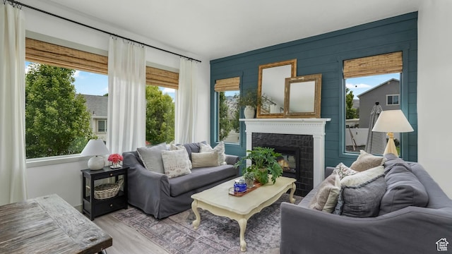 748 S Crooked Post Way, Saratoga Springs, UT 84045 - living area featuring a tiled fireplace, wood finished floors, and wooden walls