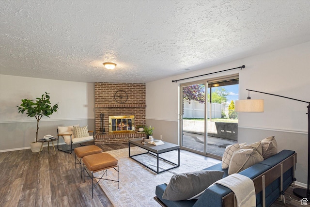 3195 E Willowcrest S, Cottonwood Heights, UT 84121 - living room featuring a textured ceiling, wood finished floors, and a brick fireplace