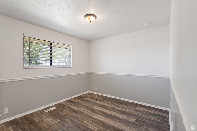 3195 E Willowcrest S, Cottonwood Heights, UT 84121 - empty room featuring dark wood-style flooring and a textured ceiling