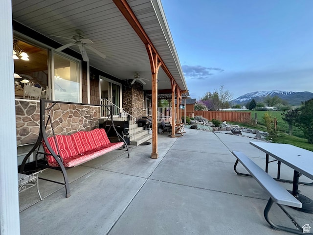 840 S Williams Cv W, Salem, UT 84653 - fenced backyard with a ceiling fan, a mountain view, and a patio