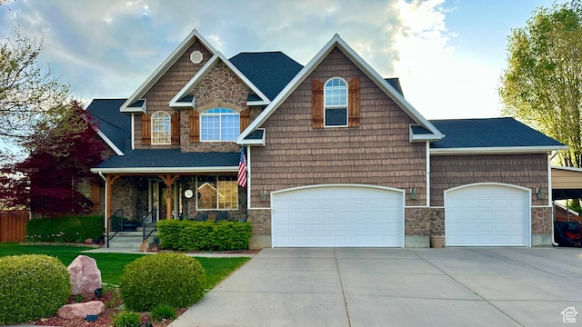840 S Williams Cv W, Salem, UT 84653 - craftsman house featuring stone siding, driveway, a garage, covered porch, and a shingled roof