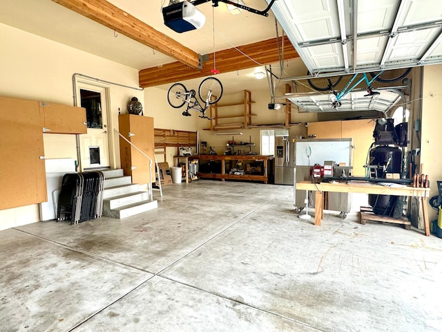 840 S Williams Cv W, Salem, UT 84653 - garage featuring a workshop area and a garage door opener