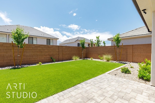 2818 E Rill Dr, Washington, UT 84780 - fenced backyard featuring a patio