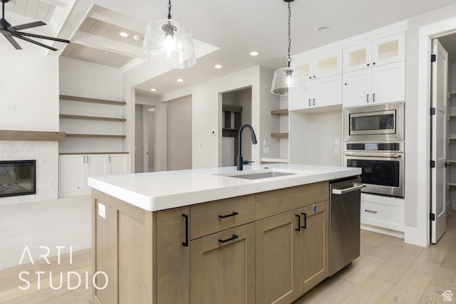 2818 E Rill Dr, Washington, UT 84780 - kitchen featuring appliances with stainless steel finishes, open shelves, white cabinets, light wood-style flooring, and recessed lighting