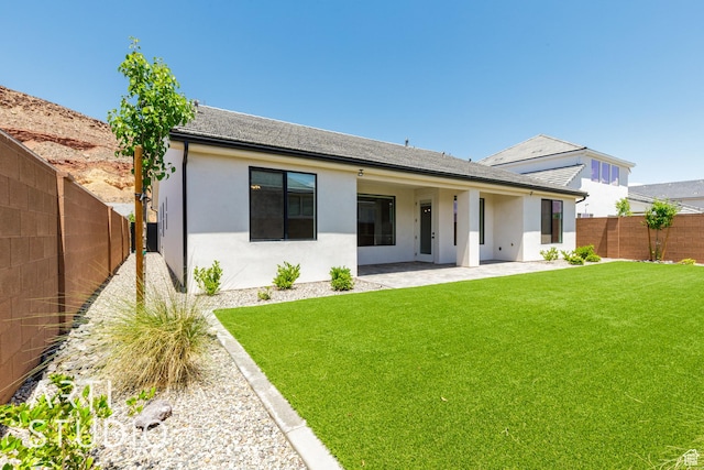 2818 E Rill Dr, Washington, UT 84780 - back of house featuring stucco siding, a fenced backyard, and a patio area