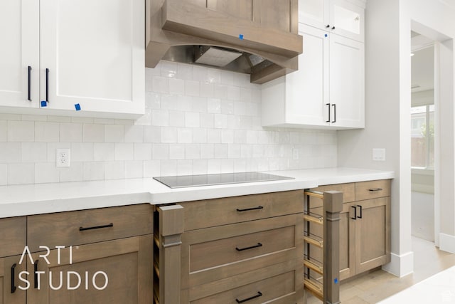 2818 E Rill Dr, Washington, UT 84780 - kitchen with ventilation hood, black electric cooktop, and white cabinets