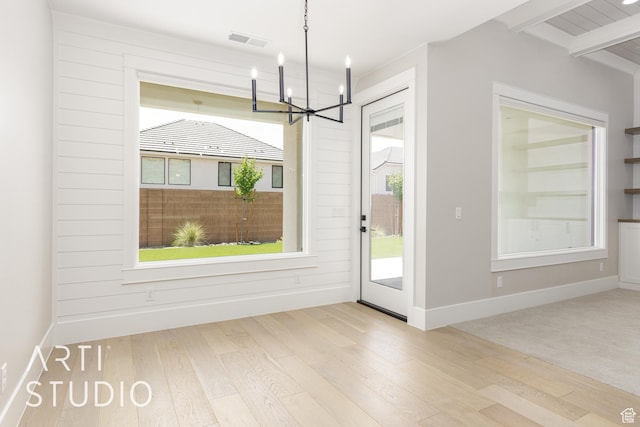2818 E Rill Dr, Washington, UT 84780 - unfurnished dining area featuring a chandelier and wood finished floors