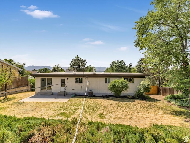 8359 S Fayeway Dr, Sandy, UT 84094 - back of house featuring a patio area, a mountain view, and a fenced backyard