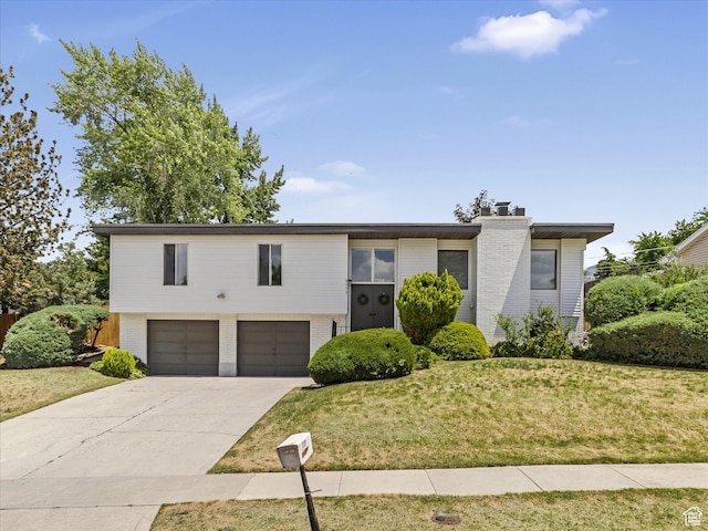 8359 S Fayeway Dr, Sandy, UT 84094 - view of front of home featuring brick siding, an attached garage, concrete driveway, a front yard, and a chimney