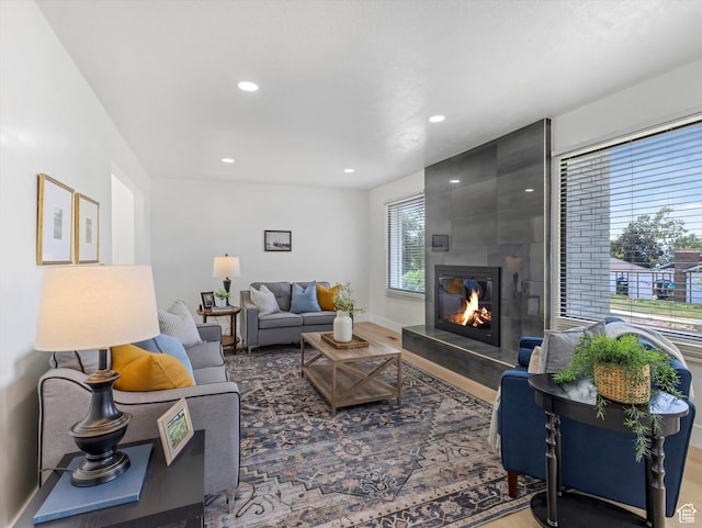 8359 S Fayeway Dr, Sandy, UT 84094 - living area with wood finished floors, a large fireplace, and recessed lighting