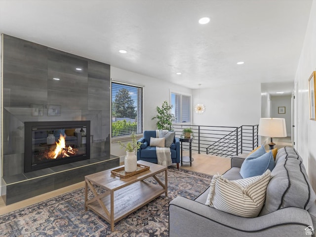 8359 S Fayeway Dr, Sandy, UT 84094 - living room featuring recessed lighting, a large fireplace, and wood finished floors