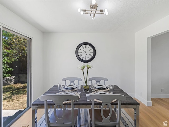 8359 S Fayeway Dr, Sandy, UT 84094 - dining space with a chandelier and light wood-style flooring