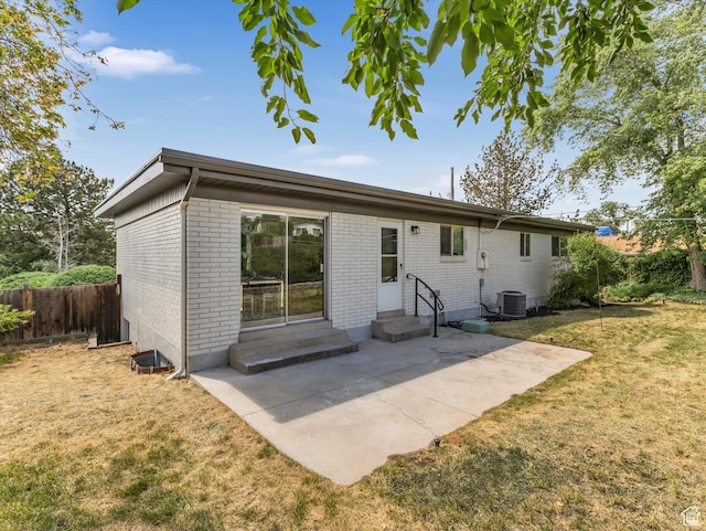 8359 S Fayeway Dr, Sandy, UT 84094 - back of house featuring entry steps, brick siding, and a patio