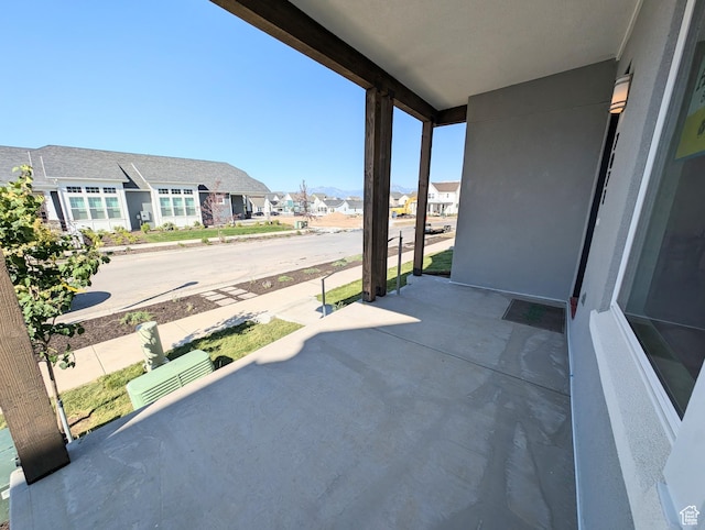 7071 W Granbury Dr S Unit 258, South Jordan, UT 84009 - view of patio featuring a residential view