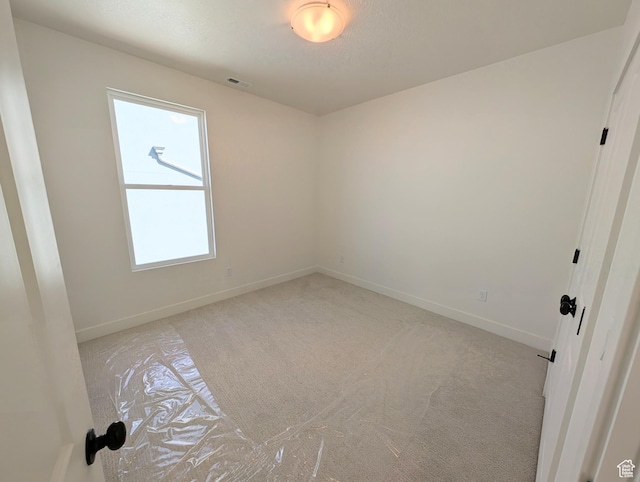 7071 W Granbury Dr S Unit 258, South Jordan, UT 84009 - spare room featuring plenty of natural light and light carpet
