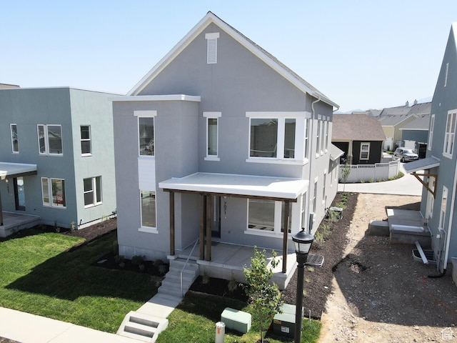 7071 W Granbury Dr S Unit 258, South Jordan, UT 84009 - view of front of house featuring stucco siding and a porch