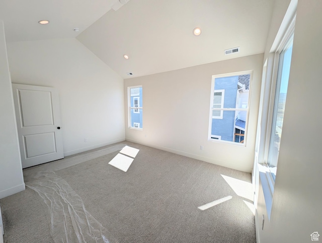 7071 W Granbury Dr S Unit 258, South Jordan, UT 84009 - empty room with carpet flooring, vaulted ceiling, healthy amount of natural light, and recessed lighting