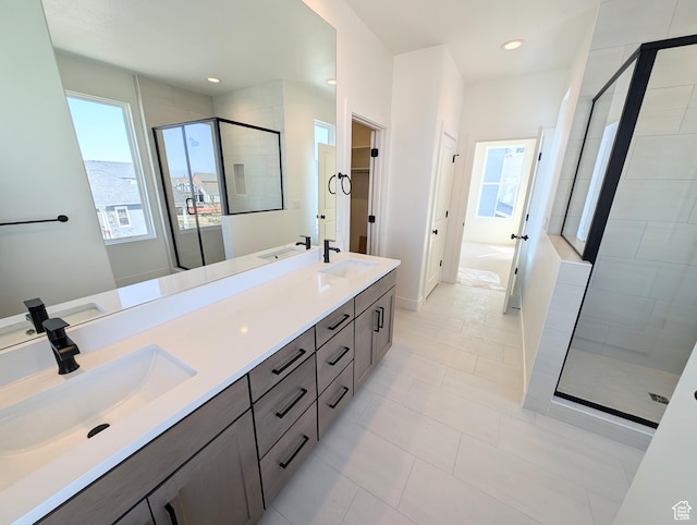7071 W Granbury Dr S Unit 258, South Jordan, UT 84009 - bathroom featuring a shower stall, a bath, double vanity, recessed lighting, and tile patterned floors