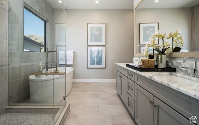 4578 N Solstice Dr Unit 332, Lehi, UT 84043 - bathroom featuring double vanity, a soaking tub, a stall shower, and recessed lighting