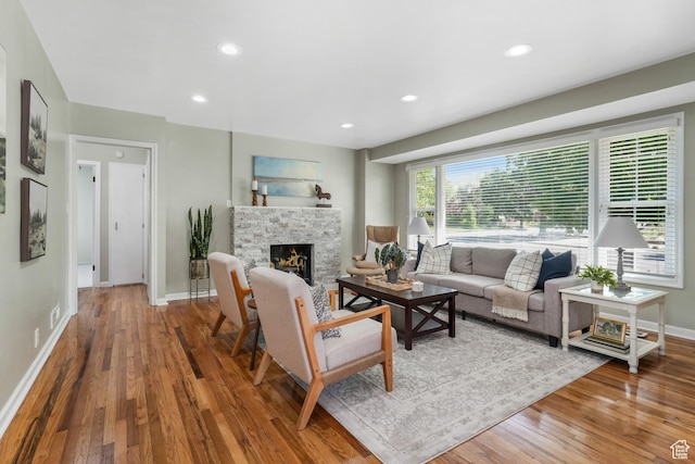 2612 S 1900 E, Salt Lake City, UT 84106 - living area with wood finished floors, a stone fireplace, and recessed lighting