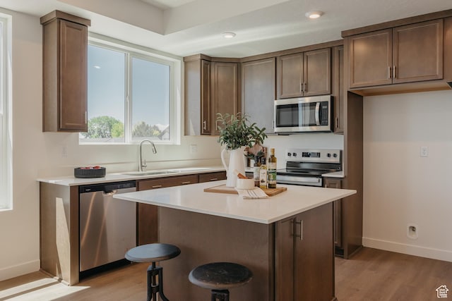 247 E 1850 N Unit 1, North Ogden, UT 84414 - kitchen featuring stainless steel appliances, light wood-style floors, light countertops, a kitchen island, and recessed lighting