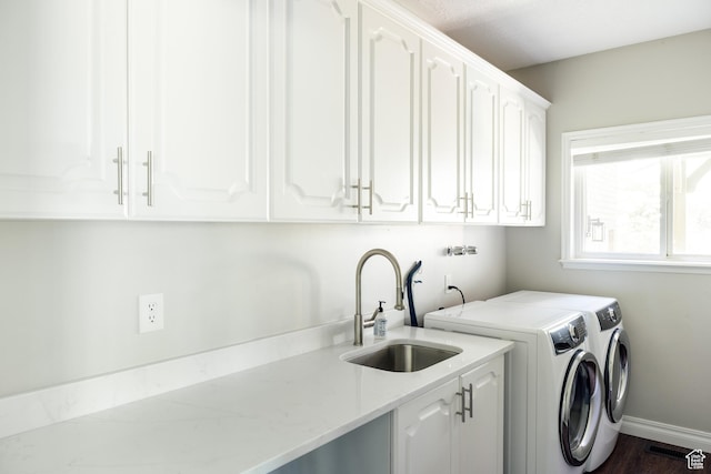 9788 S Dante Rd E, Sandy, UT 84092 - laundry area with cabinet space, washing machine and dryer, and dark wood finished floors