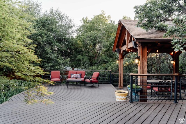 9788 S Dante Rd E, Sandy, UT 84092 - wooden deck with an outdoor hangout area