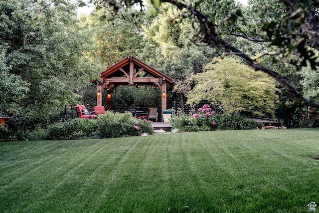 9788 S Dante Rd E, Sandy, UT 84092 - view of green lawn with a gazebo and a wooded view