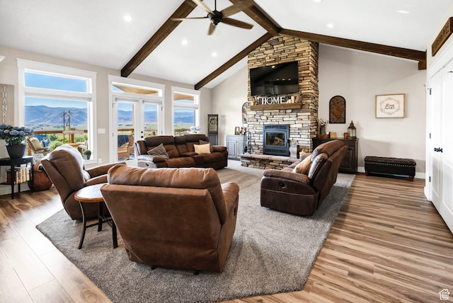 2253 N 1200 E, Monroe, UT 84754 - living area with ceiling fan, wood finished floors, a stone fireplace, recessed lighting, and a mountain view