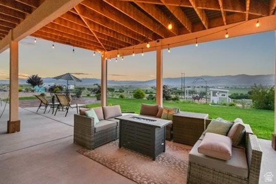 2253 N 1200 E, Monroe, UT 84754 - view of patio / terrace with an outdoor living space with a fire pit and a mountain view