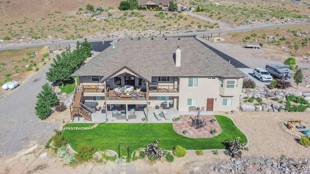 2253 N 1200 E, Monroe, UT 84754 - rear view of house with a patio, stucco siding, stairs, a balcony, and roof with shingles