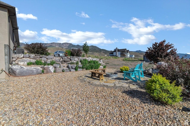 2253 N 1200 E, Monroe, UT 84754 - view of yard featuring a mountain view, an outdoor fire pit, and a patio