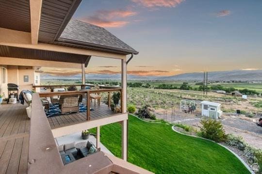 2253 N 1200 E, Monroe, UT 84754 - deck at dusk with outdoor dining area and a lawn