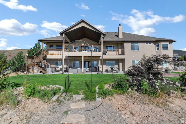 2253 N 1200 E, Monroe, UT 84754 - back of house with stucco siding, a lawn, a patio area, a chimney, and stairway