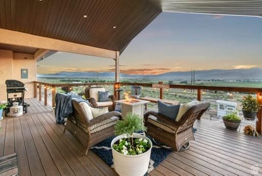 2253 N 1200 E, Monroe, UT 84754 - deck at dusk with a grill and an outdoor living space with a fire pit