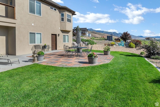 2253 N 1200 E, Monroe, UT 84754 - view of grassy yard featuring a mountain view and a patio area