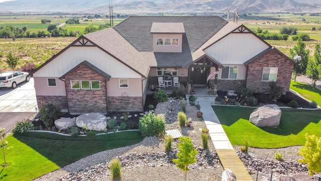 2253 N 1200 E, Monroe, UT 84754 - craftsman inspired home featuring stone siding, a shingled roof, a mountain view, and a front yard