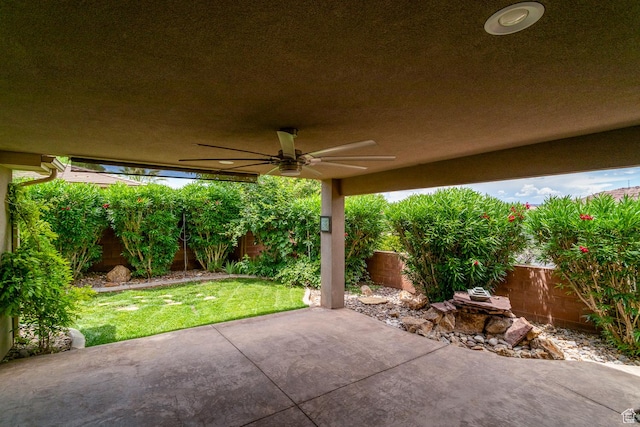 3524 S Price Hills Dr, St George, UT 84790 - fenced backyard with ceiling fan and a patio area