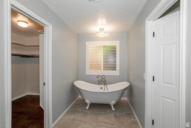 3524 S Price Hills Dr, St George, UT 84790 - bathroom featuring a soaking tub and a closet